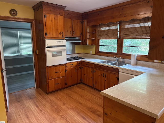 2 Runion Dr, Taylors, SC 29687 - kitchen with white oven, light wood finished floors, light countertops, and brown cabinetry