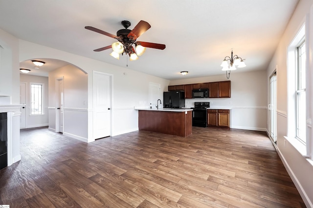 319 Aniken Cir, Boiling Springs, SC 29316 - kitchen featuring black appliances, wood finished floors, light countertops, a ceiling fan, and arched walkways
