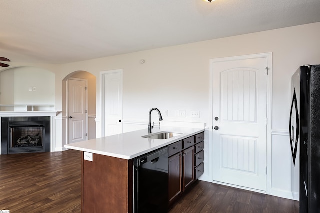 319 Aniken Cir, Boiling Springs, SC 29316 - kitchen with dishwashing machine, freestanding refrigerator, dark wood-style flooring, light countertops, and a fireplace