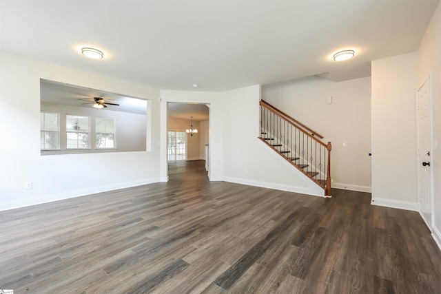 515 Etowah Dr, Roebuck, SC 29376 - unfurnished living room featuring stairs, dark wood-type flooring, a chandelier, and ceiling fan