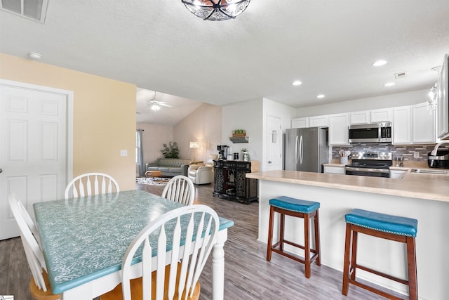 640 Slippery Moss Dr, Spartanburg, SC 29303 - dining room with light wood-style flooring, recessed lighting, a textured ceiling, and ceiling fan