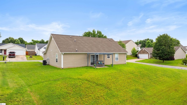 640 Slippery Moss Dr, Spartanburg, SC 29303 - rear view of house featuring a detached garage, a lawn, a shingled roof, a residential view, and concrete driveway