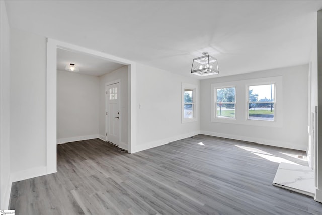 721 Central St, Iva, SC 29655 - unfurnished dining area with wood finished floors and a chandelier