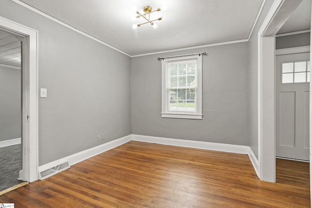 2608 Lane Ave, Anderson, SC 29621 - entrance foyer with crown molding, wood finished floors, and a chandelier