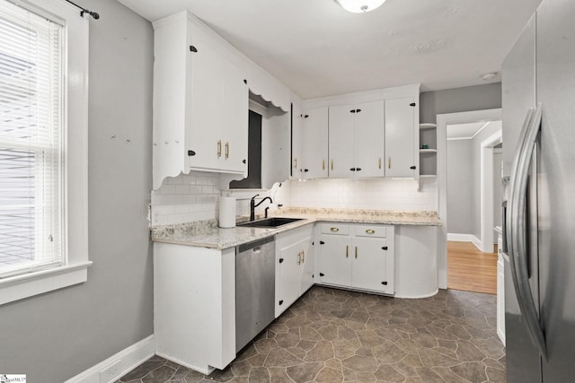 2608 Lane Ave, Anderson, SC 29621 - kitchen with stainless steel appliances, decorative backsplash, open shelves, and white cabinetry