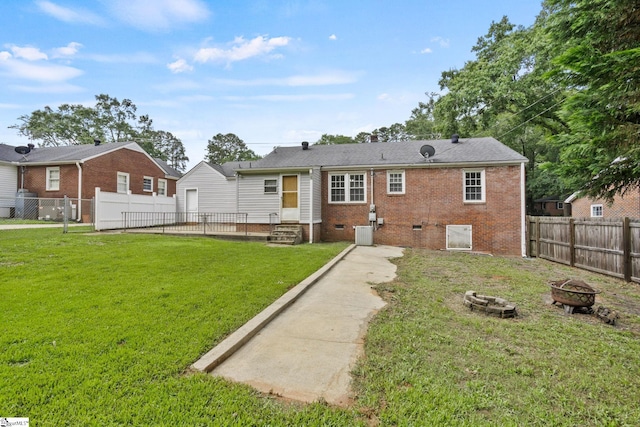 2608 Lane Ave, Anderson, SC 29621 - rear view of property featuring an outdoor fire pit, crawl space, a fenced backyard, entry steps, and brick siding