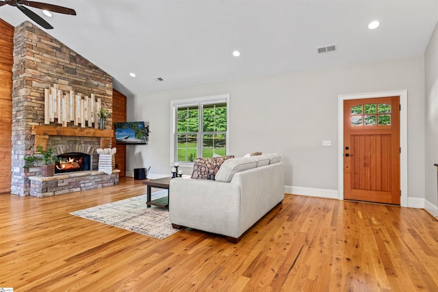 19 Merritt View Ter, Greenville, SC 29609 - living room featuring a ceiling fan, wood finished floors, lofted ceiling, a stone fireplace, and recessed lighting