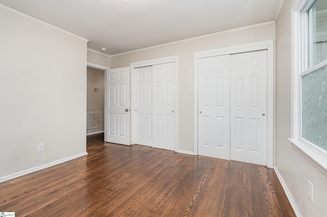 509 Montague St, Anderson, SC 29624 - unfurnished bedroom featuring two closets, wood finished floors, and ornamental molding