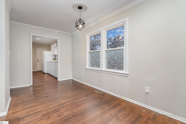 509 Montague St, Anderson, SC 29624 - unfurnished dining area with dark wood finished floors and crown molding