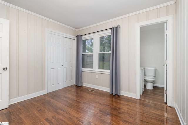 509 Montague St, Anderson, SC 29624 - unfurnished bedroom featuring ornamental molding, dark wood-style flooring, a closet, and ensuite bathroom