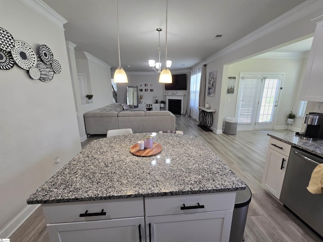 406 Willow Grove Way, Anderson, SC 29631 - kitchen with stainless steel dishwasher, crown molding, light stone countertops, and light wood-style flooring
