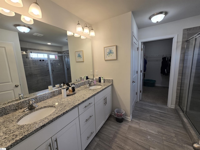 406 Willow Grove Way, Anderson, SC 29631 - full bathroom with a stall shower, double vanity, and a walk in closet