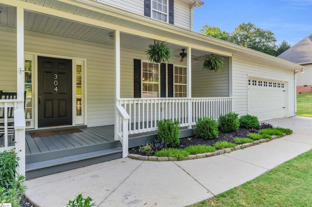 304 Camperdown Ct, Easley, SC 29642 - doorway to property with covered porch, an attached garage, concrete driveway, and ceiling fan
