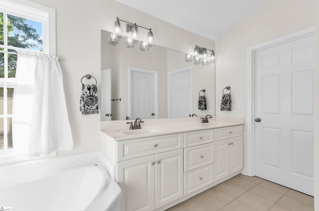 304 Camperdown Ct, Easley, SC 29642 - bathroom with tile patterned floors, double vanity, and a bath