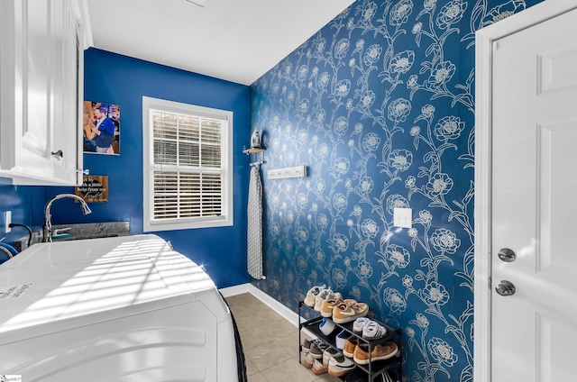 304 Camperdown Ct, Easley, SC 29642 - laundry room with wallpapered walls, tile patterned flooring, and cabinet space