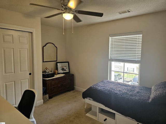 632 Lookover Dr, Anderson, SC 29621 - bedroom featuring light colored carpet, a ceiling fan, and a textured ceiling