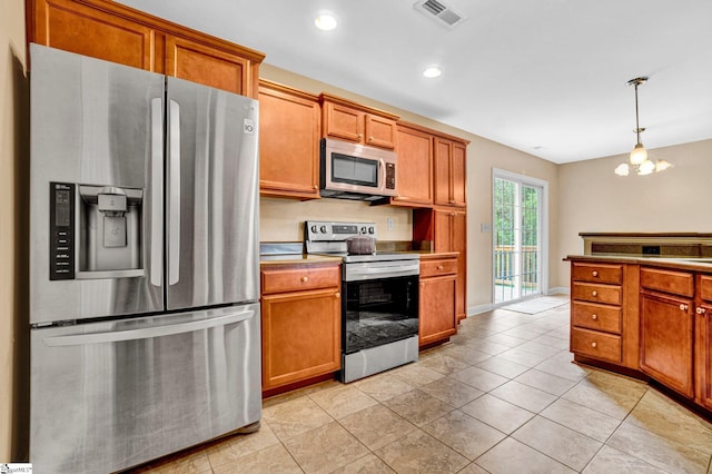 305 Cunningham Rd, Woodruff, SC 29388 - kitchen featuring stainless steel appliances, brown cabinetry, decorative light fixtures, and recessed lighting