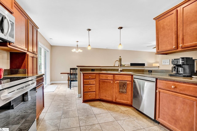 305 Cunningham Rd, Woodruff, SC 29388 - kitchen with dishwasher, white microwave, range with electric stovetop, a peninsula, and a chandelier
