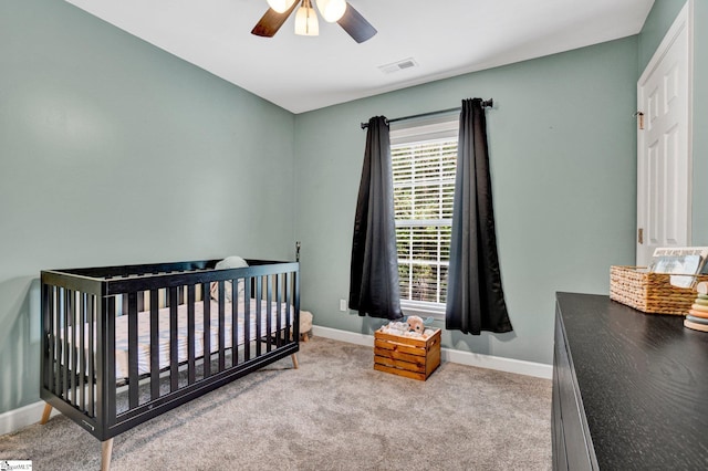 305 Cunningham Rd, Woodruff, SC 29388 - carpeted bedroom with a ceiling fan and a crib