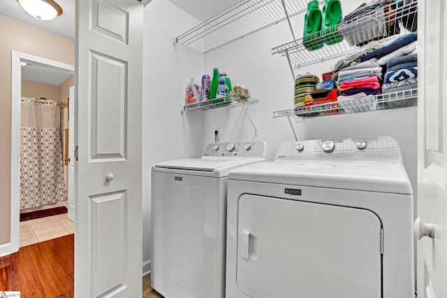 305 Cunningham Rd, Woodruff, SC 29388 - washroom featuring separate washer and dryer and wood finished floors