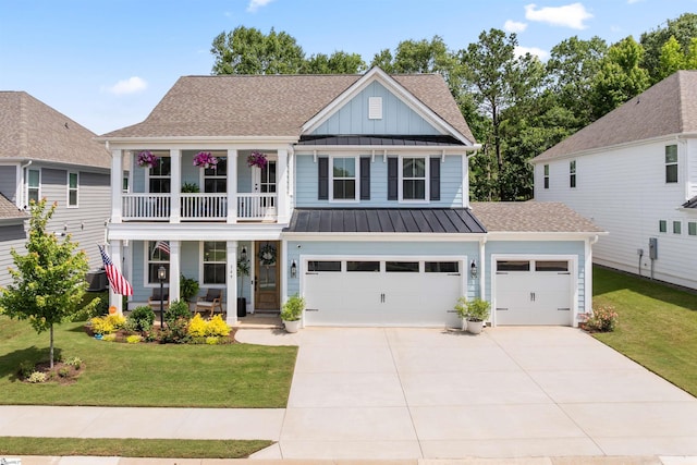 349 Encampment Blvd, Simpsonville, SC 29681 - view of front of property featuring a porch, board and batten siding, a standing seam roof, a front yard, and driveway