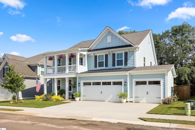 349 Encampment Blvd, Simpsonville, SC 29681 - view of front of property featuring board and batten siding, driveway, an attached garage, covered porch, and a balcony