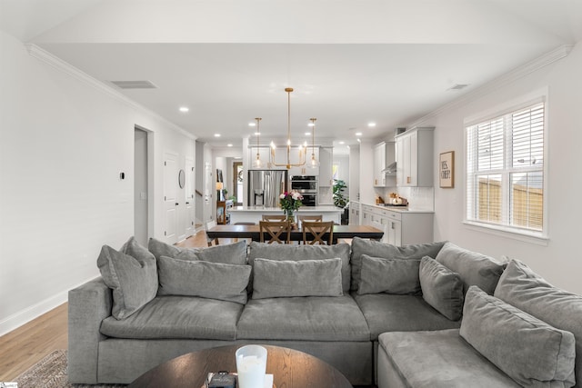349 Encampment Blvd, Simpsonville, SC 29681 - living area with light wood-type flooring, crown molding, and recessed lighting