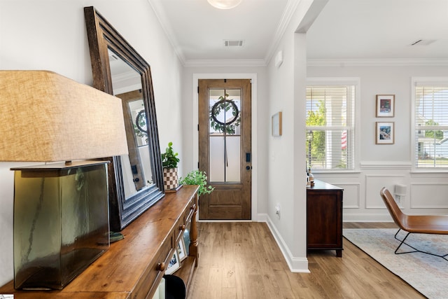 349 Encampment Blvd, Simpsonville, SC 29681 - entrance foyer with light wood finished floors, crown molding, and a wainscoted wall