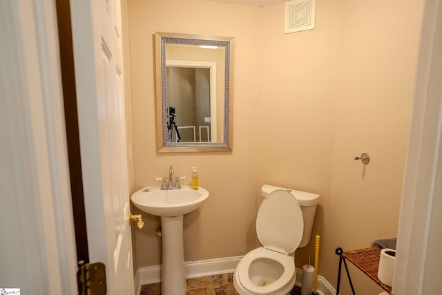126 Midland Dr, Easley, SC 29640 - half bathroom featuring baseboards and toilet