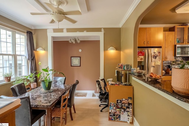 126 Midland Dr, Easley, SC 29640 - dining space with arched walkways, ceiling fan, and crown molding