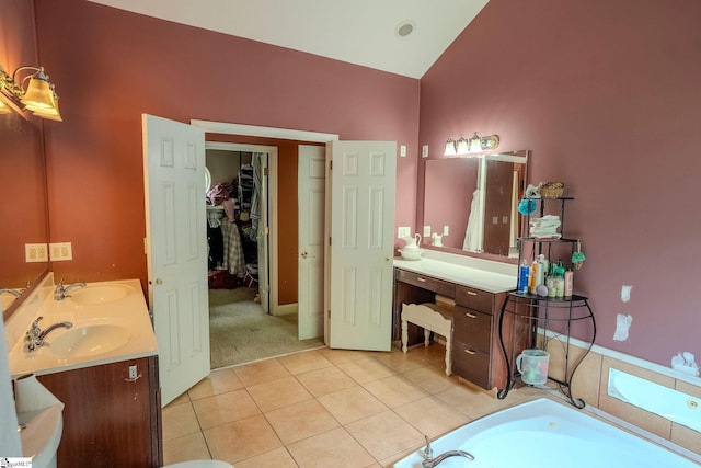 126 Midland Dr, Easley, SC 29640 - bathroom featuring double vanity, tile patterned floors, a tub to relax in, vaulted ceiling, and a walk in closet