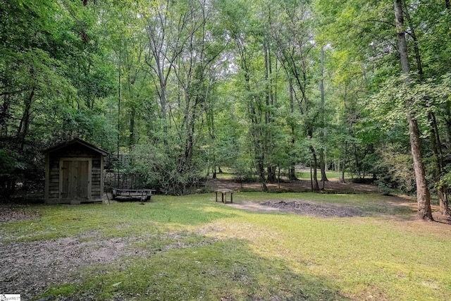 126 Midland Dr, Easley, SC 29640 - view of green lawn with a storage shed and a view of trees