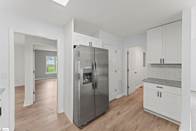 2005 Gap Creek Rd, Greer, SC 29651 - kitchen featuring stainless steel fridge, white cabinets, light wood-type flooring, and backsplash