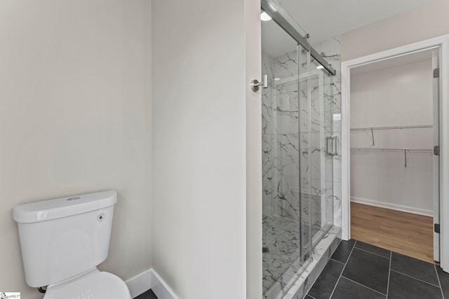2005 Gap Creek Rd, Greer, SC 29651 - full bathroom featuring a marble finish shower, tile patterned flooring, and a walk in closet