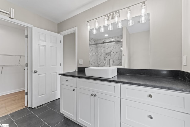 2005 Gap Creek Rd, Greer, SC 29651 - full bath featuring vanity, a marble finish shower, tile patterned flooring, and a walk in closet