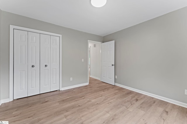 2005 Gap Creek Rd, Greer, SC 29651 - unfurnished bedroom with light wood-style flooring and a closet