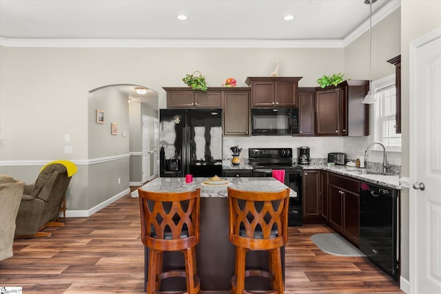 906 John Thomas Way, Greer, SC 29651 - kitchen with black appliances, dark brown cabinets, dark wood-type flooring, arched walkways, and crown molding