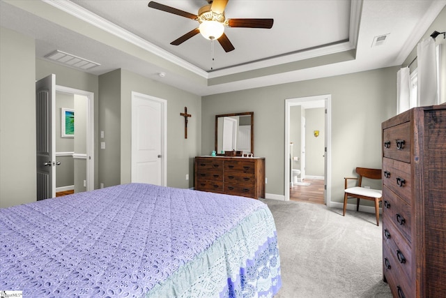 906 John Thomas Way, Greer, SC 29651 - carpeted bedroom with a tray ceiling, ornamental molding, ceiling fan, and ensuite bath