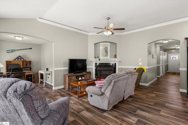 906 John Thomas Way, Greer, SC 29651 - living area with arched walkways, a ceiling fan, wood finished floors, a tiled fireplace, and vaulted ceiling