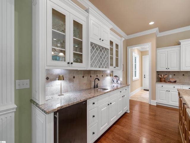 24 Lake Hills Ln, Travelers Rest, SC 29690 - bar featuring tasteful backsplash, ornamental molding, and wood finished floors