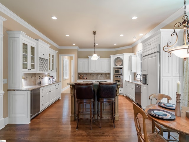 24 Lake Hills Ln, Travelers Rest, SC 29690 - kitchen featuring built in appliances, white cabinets, a kitchen island, tasteful backsplash, and recessed lighting