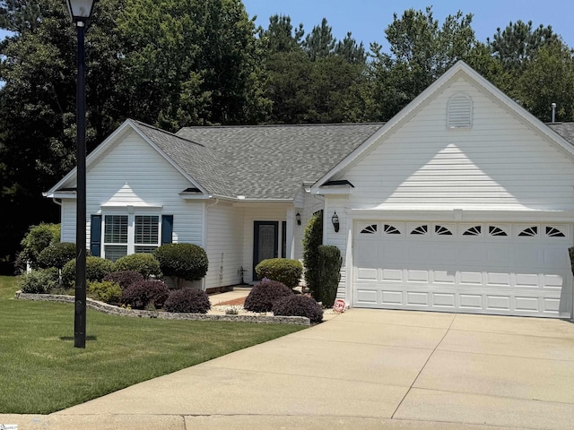 9 Kenton Finch Ct, Simpsonville, SC 29681 - single story home featuring roof with shingles, driveway, a front lawn, and an attached garage