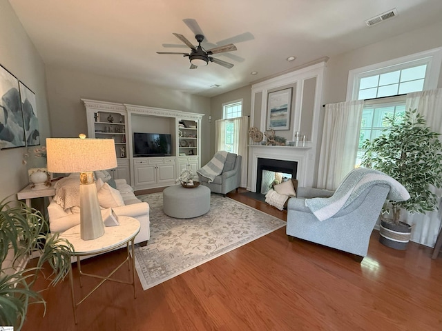 9 Kenton Finch Ct, Simpsonville, SC 29681 - living room featuring wood finished floors, ceiling fan, a fireplace, and recessed lighting