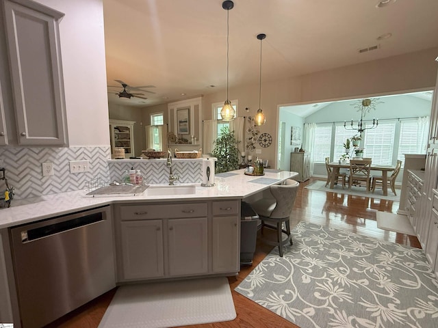 9 Kenton Finch Ct, Simpsonville, SC 29681 - kitchen with stainless steel dishwasher, a peninsula, gray cabinets, ceiling fan, and tasteful backsplash