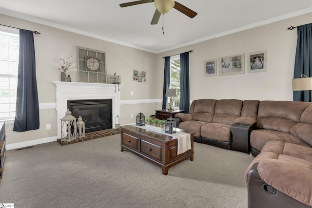 112 Friesian Ct, Pelzer, SC 29669 - carpeted living room featuring ceiling fan, ornamental molding, and a glass covered fireplace