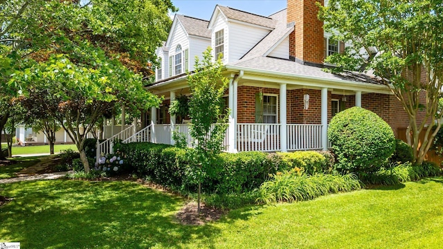 14 Quail Meadow Ln, Greenville, SC 29617 - view of side of home featuring covered porch, a chimney, a yard, and roof with shingles