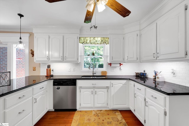 14 Quail Meadow Ln, Greenville, SC 29617 - kitchen with stainless steel dishwasher, dark countertops, a ceiling fan, dark wood finished floors, and ornamental molding