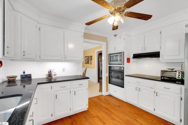 14 Quail Meadow Ln, Greenville, SC 29617 - kitchen with black appliances, under cabinet range hood, a ceiling fan, light wood finished floors, and white cabinetry