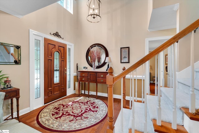 14 Quail Meadow Ln, Greenville, SC 29617 - foyer entrance featuring stairs, wood finished floors, a towering ceiling, and a chandelier