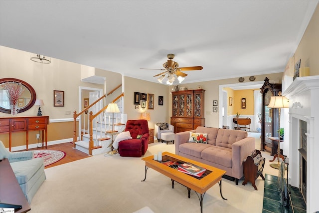 14 Quail Meadow Ln, Greenville, SC 29617 - living area featuring a fireplace with flush hearth, stairs, and a ceiling fan